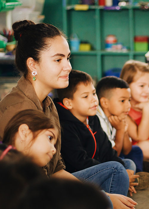 Teacher in classroom with small children